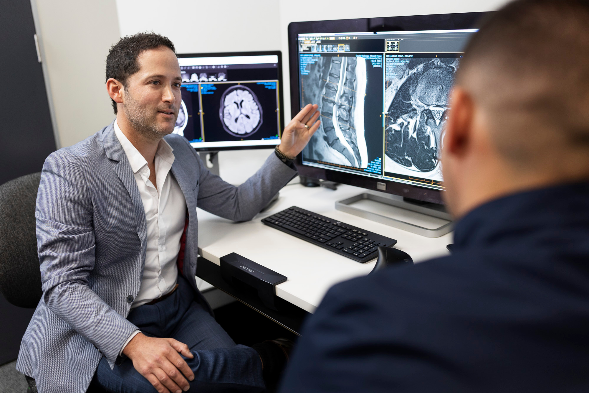 Male Doctor Explaining X ray Results to Patient | Australia Radiology Clinic | Radiology Tasmania